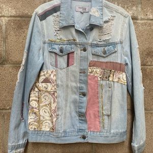 One of a kind, upcycled denim jacket.